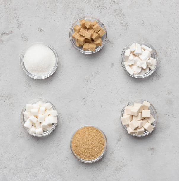 Collection of different kinds of sugar on gray background