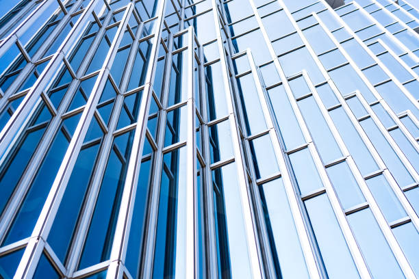 istock underside panoramic and perspective view to steel blue glass high rise building skyscrapers, business concept of successful industrial architecture 1130497312