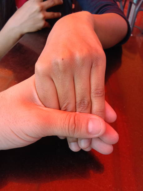 Close-up of couple holding hands