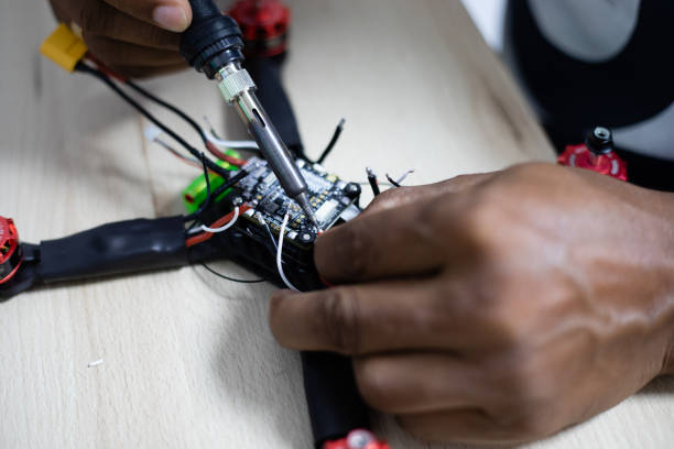 istock Hands soldering a racing drone 1130500316