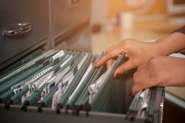 Important documents in files placed in the filing cabinet stock photo