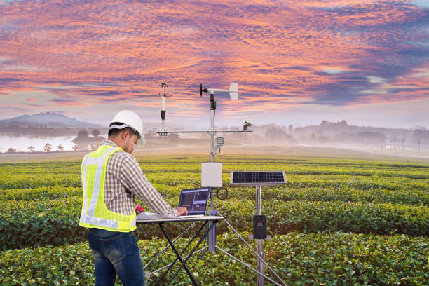 agronomist using tablet computer collect data with meteorologic - anemometer meteorology measuring wind imagens e fotografias de stock