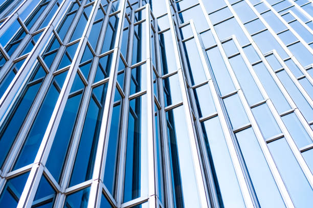 istock underside panoramic and perspective view to steel blue glass high rise building skyscrapers, business concept of successful industrial architecture 1130500621
