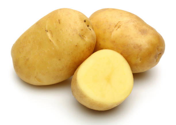 istock Fresh potatoes with slices isolated on white 1130502514