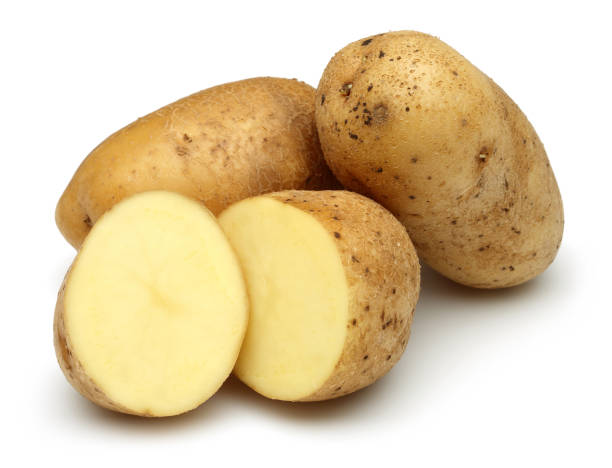 istock Fresh potatoes with slices isolated on white 1130502687