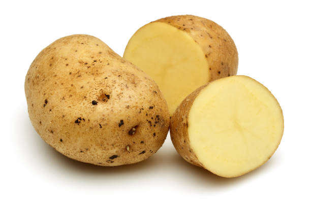 istock Fresh potatoes with slices isolated on white 1130502690
