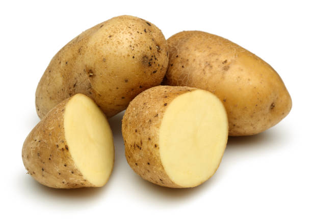istock Fresh potatoes with slices isolated on white 1130502762
