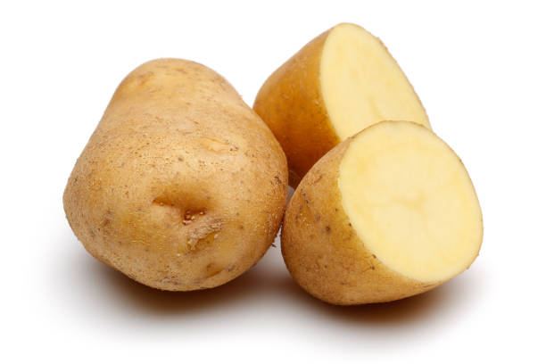 istock Fresh potatoes with slices isolated on white 1130502839