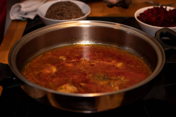 istock cook preparing lamb soup with vegetables in the kitchen 1130504924