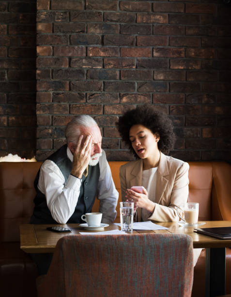 istock Business man and woman reviewing some documents. 1130504994