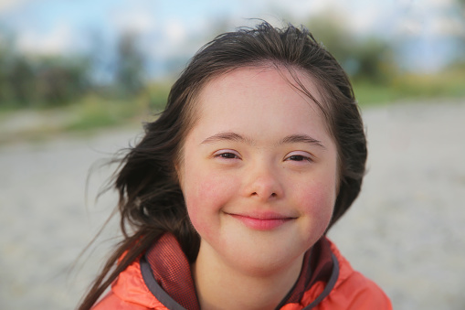 Portrait of down syndrome girl smiling