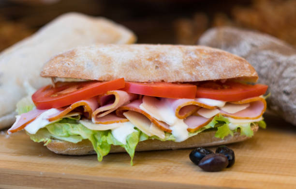 istock fresh made ingredients inside ciabatta rolls on wooden surface. 1130505874