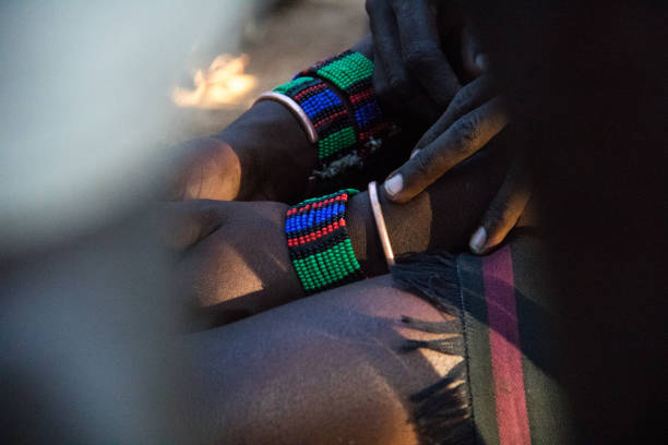 Ethiopia: Hamer Decorations Hamer bracelets on the wrist of a man about to participate in a Bull Jumping Ceremony. hamer tribe photos stock pictures, royalty-free photos & images
