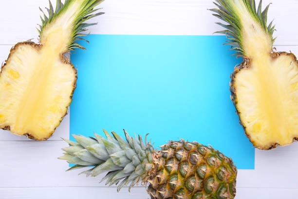 istock Pineapple and half of pineapple on a white background, with copy space 1130507661