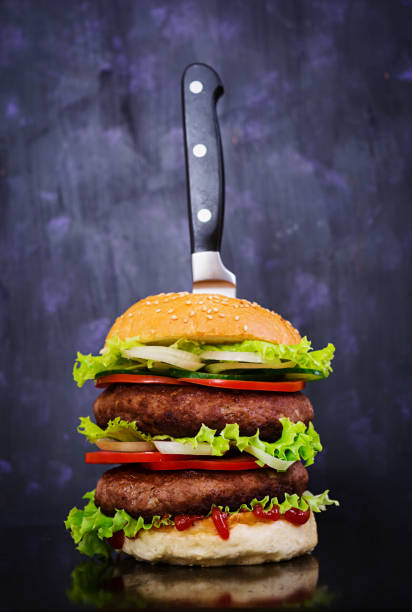 istock Delicious handmade burger on dark background. Close view 1130507911