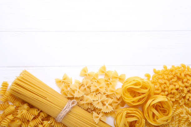 istock Delicious mixed pasta on a white wooden background 1130508361