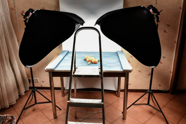 Photographing tangerines on a blue wooden background. Backstage