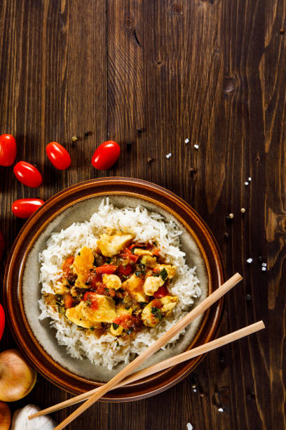 istock Grilled meat, white rice and vegetables on wooden table 1130510499