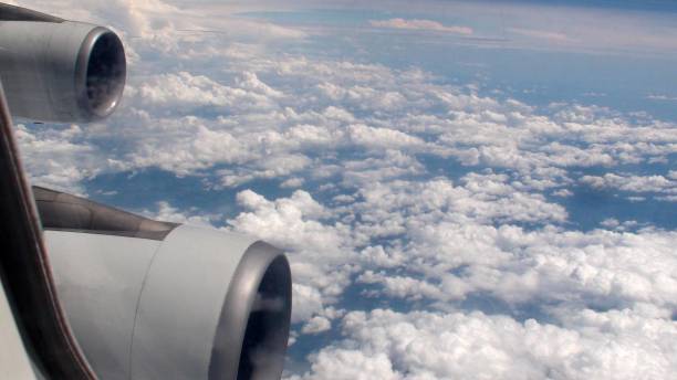 jet engine plus cloud view in mid air - cloud mid air cloudscape aerial view imagens e fotografias de stock