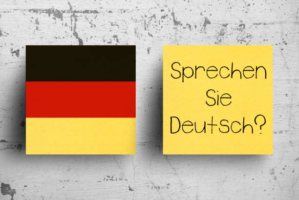 istock Sticky note on concrete wall. Do you speak German? Do You Speak German? 1130510863