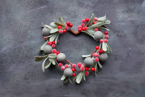 istock Christmas flat lay with mistletoe wreath on dark 1130511604
