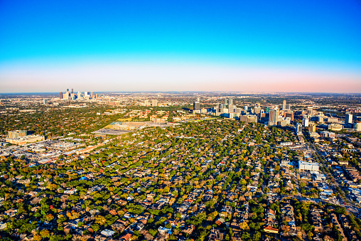 Wide angle view of the metropolitan area of Houston, Texas including the downtown skyline, the Houston Medical Center and the surrounding suburban neighborhoods shot from an altitude of about 1500 feet.