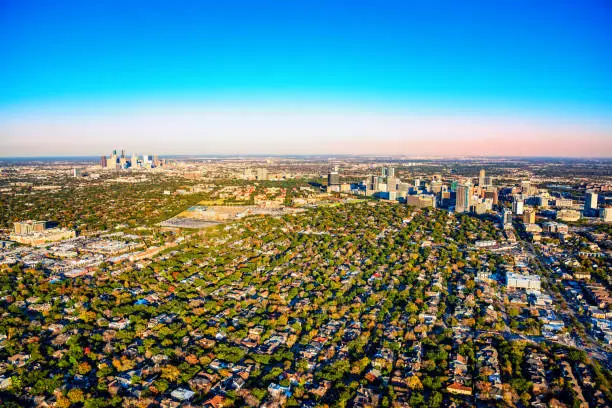 Wide angle view of the metropolitan area of Houston, Texas including the downtown skyline, the Houston Medical Center and the surrounding suburban neighborhoods shot from an altitude of about 1500 feet.