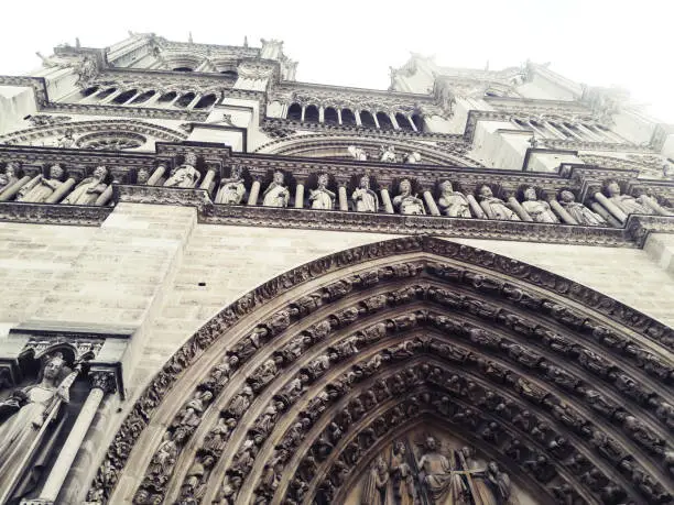 París, Francia. july 2018. View from the ground of the lower and upper part of the facade of the Notre Dame cathedral in Paris, example of a Gothic building