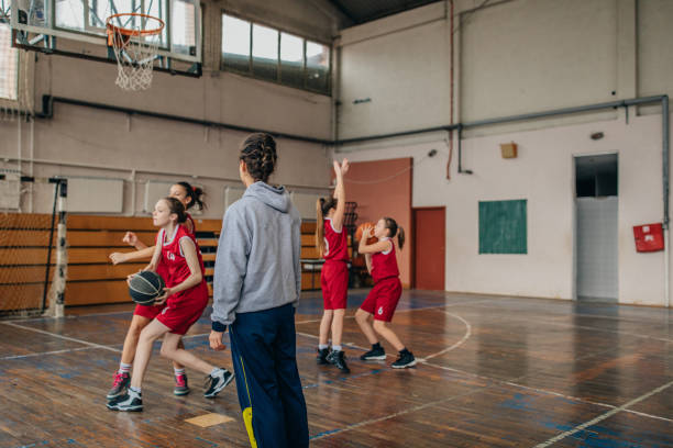 istock Basketball coach watching her players training 1130513044