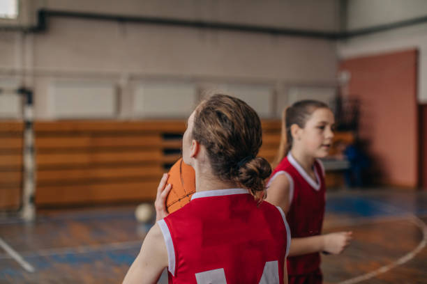 istock Two young girls on basketball practice 1130513233