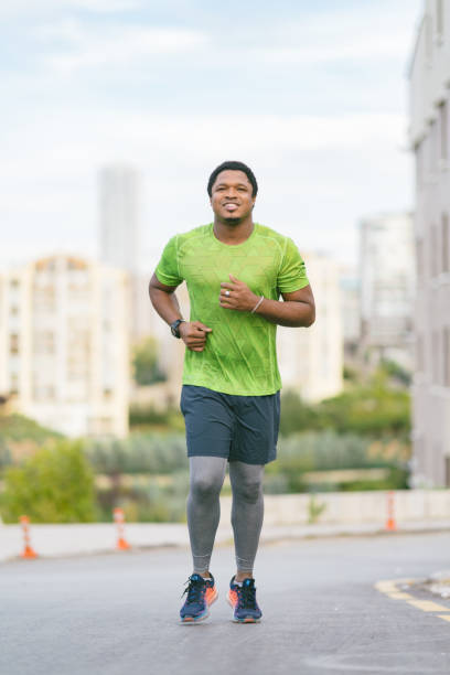 istock Young man running in the street 1130513477