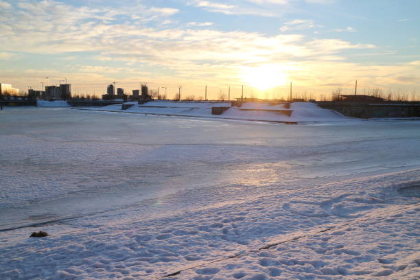 istock sunsets on city pond in winter 1130514492