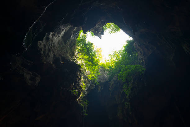 istock light shine through in Khao Luang Cave in Phetchaburi , Thailand. 1130517929