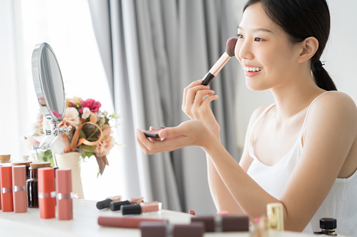 Young Asian female makeup beauty by Makeup Brush