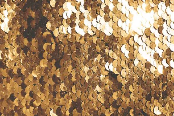 background of gold sequins. shiny sparkling background
