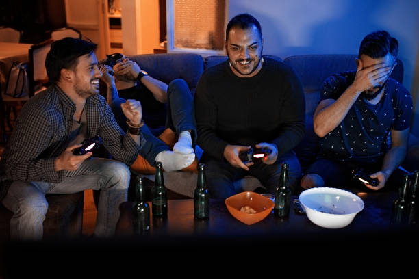 istock Four guys playing video games 1130520411