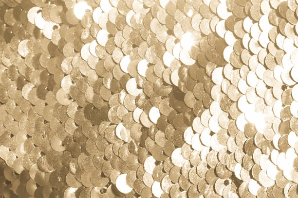 istock background of gold sequins. shiny sparkling background 1130520450