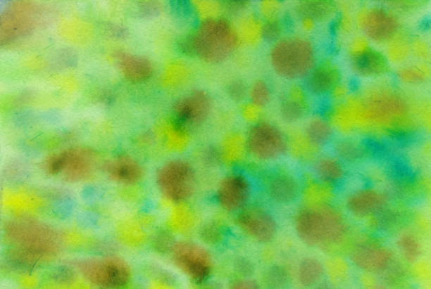 istock Bright green texture with brown and yellow spots 1130521253