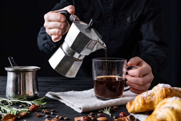istock Pouring coffee from an italian percolator, shot in low key 1130521694