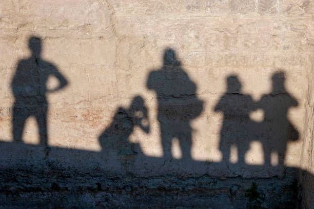 istock shadows of  women and  men 1130523363