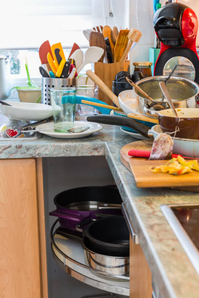 istock Compulsive Hoarding Syndrom - messy kitchen with pile of dirty dishes 1130523742