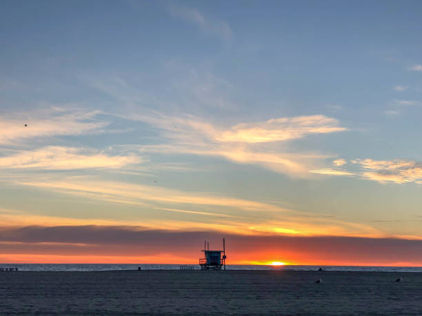 istock Watching the sunset over the pacific ocean in Venice, CA in wintertime 1130525060