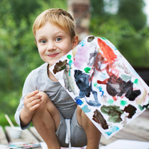 istock Little boy showing his drawing 1130526106
