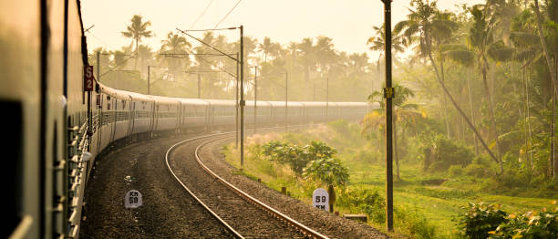 Sunrise and Train Journey View of a train turning at a Curve, early in the morning indian train journey stock pictures, royalty-free photos & images