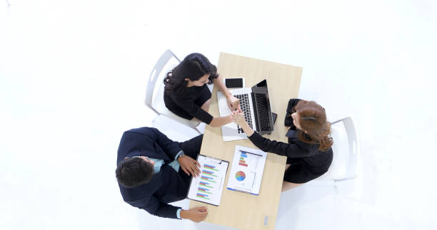 istock High Angle View Of Business People Working On Table 1130526820