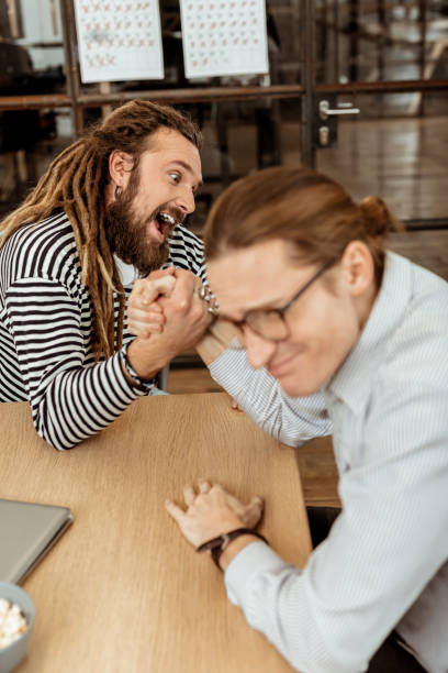 Nice emotional man putting all his strength