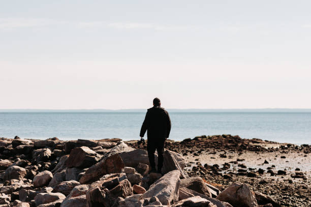 istock Adventure man Walking on the Rocks 1130529721
