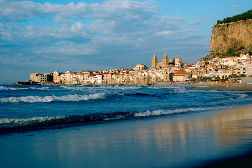 The city of Cefalu is situated in the northern part of Sicily. It has a medieval character, and the unfinished Norman cathedral, begun by Roger II in 1131, is impressive inside and outside. The rock called Rocca di Cefalù forms a dramatic backdrop to the cathedral and the old city.