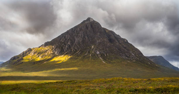 First sunbeams after rain on the mountain Buachaille Etive Mor after rain under first sunbeams buachaille etive mor photos stock pictures, royalty-free photos & images
