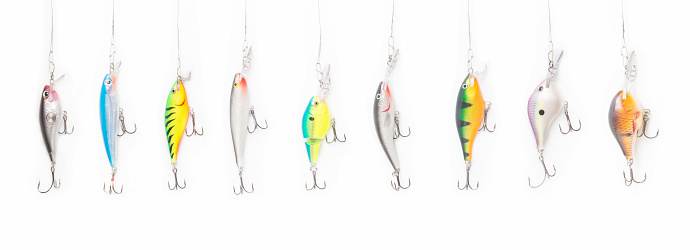 Fishing lures on white background for catching predatory fish.
